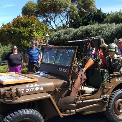 a group of people riding on the back of a truck