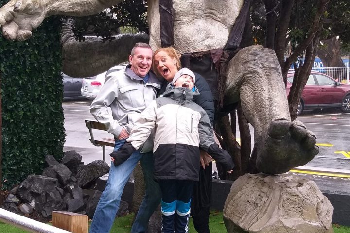 a group of people sitting at a zoo