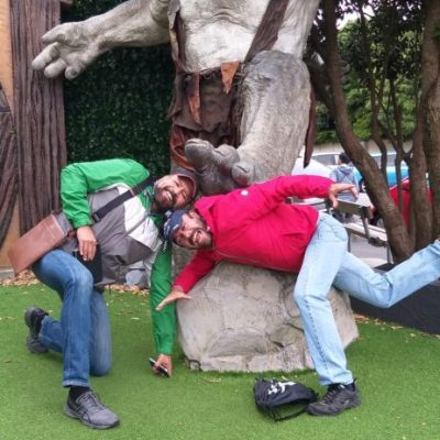 a group of people sitting in the grass