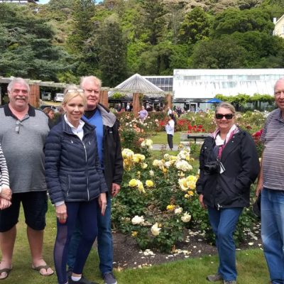 a group of people that are standing in the grass