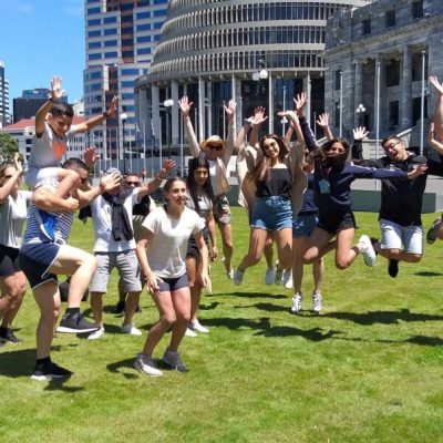 a group of people playing a game of frisbee
